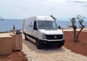 Dox Log Van Delivering Cargo on Location
